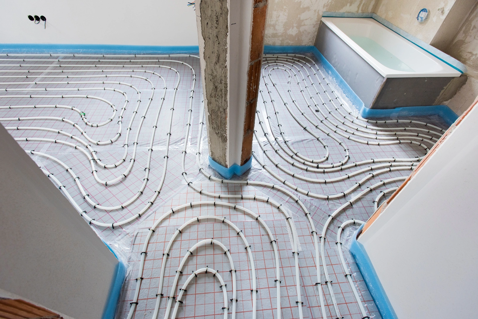 Hydronic radiant floor heating tubing laid out before a pour in Barrie